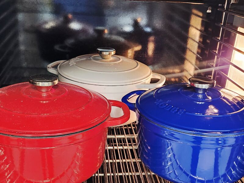 Cast iron pots heating in the oven