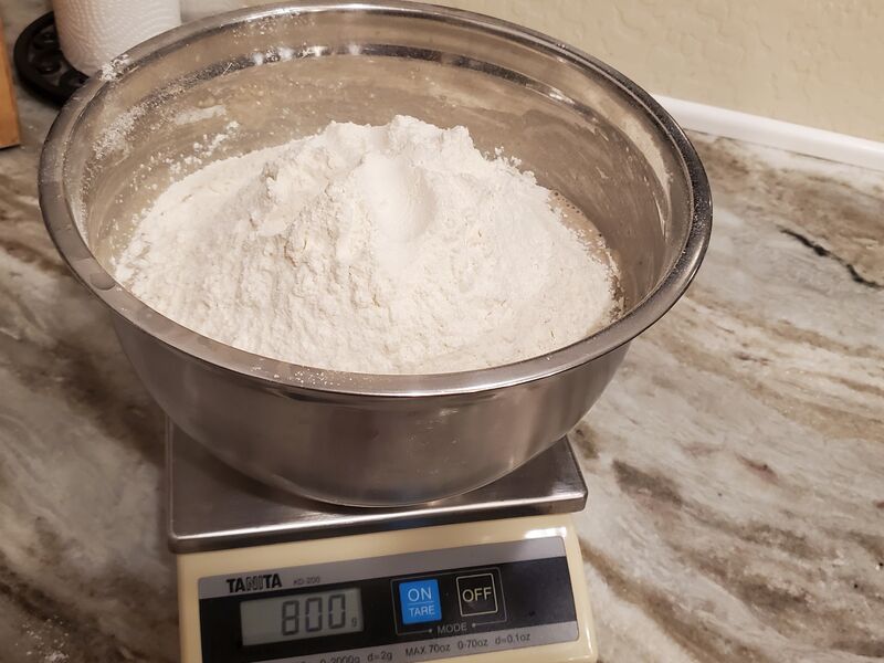 Flour being weighed out on a kitchen scale